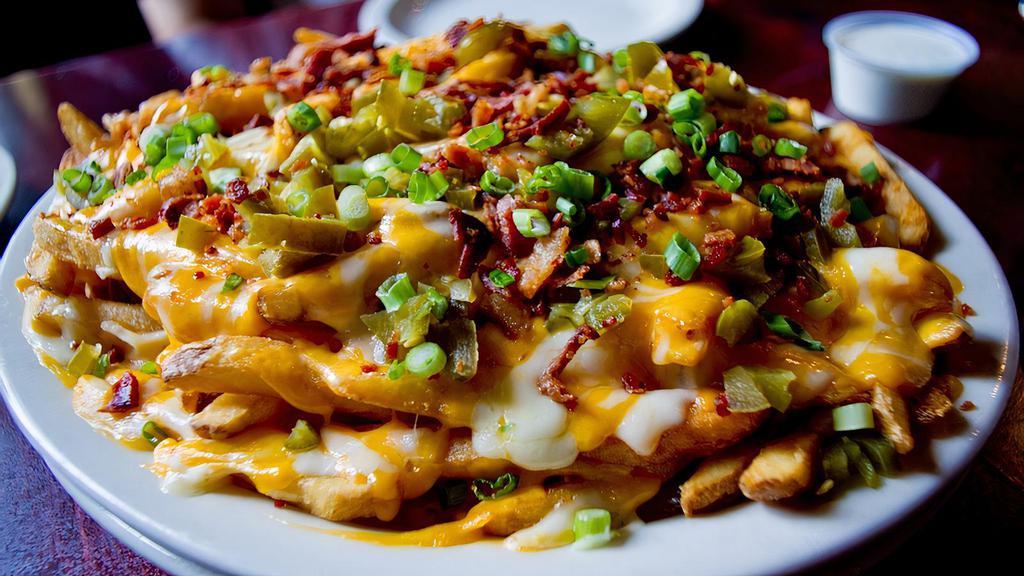 Loaded Cheese Fries · Fries smothered in melted cheddar and jack cheeses, bacon, jalapeños and chives. Ranch dressing on the side.