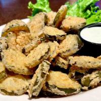 Fried Pickle Chips · Lightly breaded pickle chips served with ranch dressing on the side.