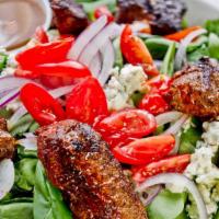 Black & Bleu Salad · Fresh spinach topped with blackened chicken or steak, red onions, tomatoes and bleu cheese c...