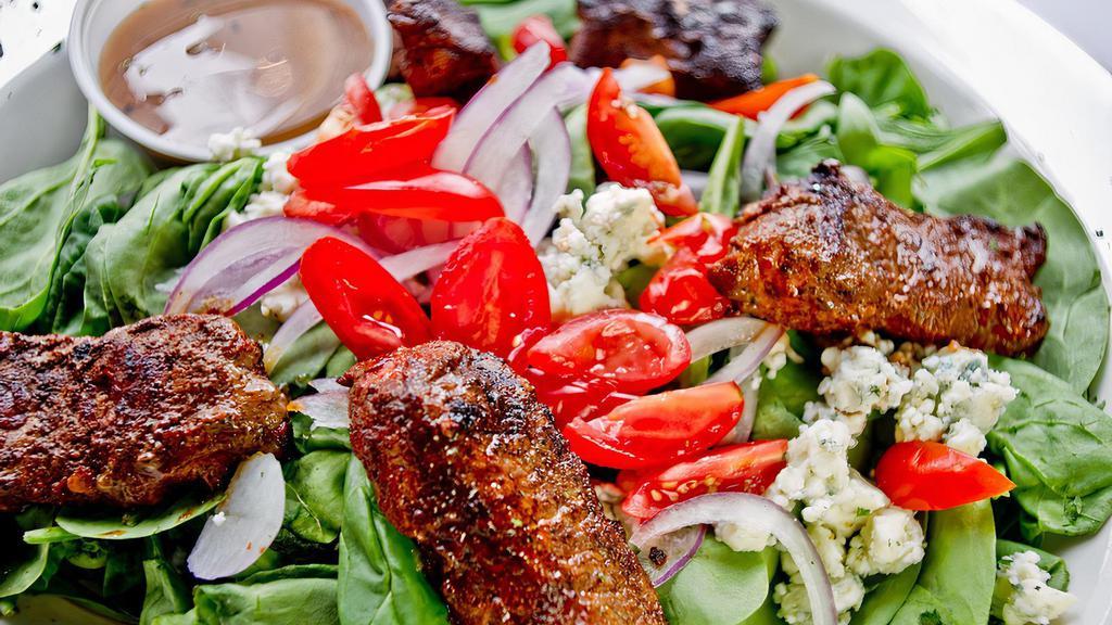 Black & Bleu Salad · Fresh spinach topped with blackened chicken or steak, red onions, tomatoes and bleu cheese crumbles. Balsamic vinaigrette on the side.