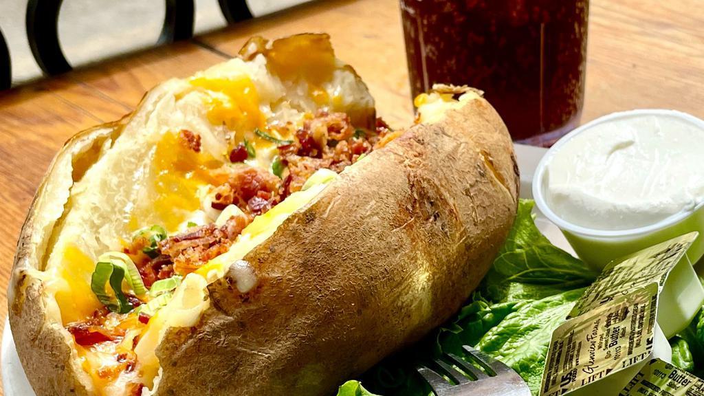 Loaded Baked Potato · Stuffed with cheddar & jack cheeses, bacon and chives. Sour cream and butter on the side.
