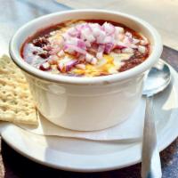 Shiner Bock Chili · House-made chili recipe with Shiner-infused ground beef. Topped with cheese and onions.