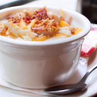 Potato Bacon Soup · Hearty potato chunks with bacon, carrots and celery in a cream base. Topped with shredded ch...