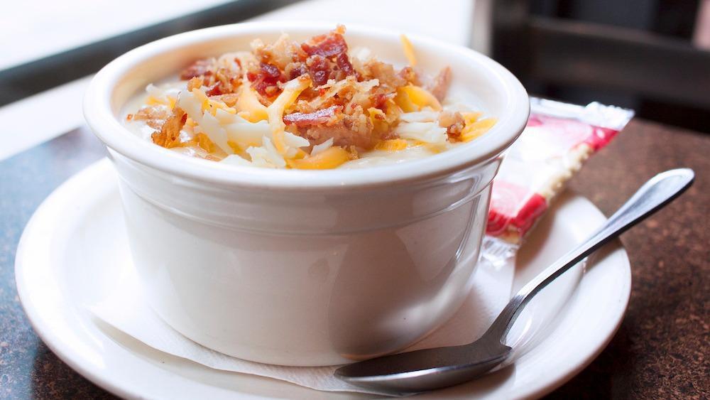 Potato Bacon Soup · Hearty potato chunks with bacon, carrots and celery in a cream base. Topped with shredded cheese and bacon bits.