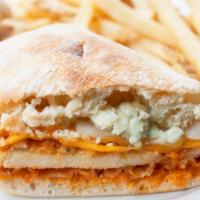 Buffalo Chicken Sandwich · Spicy breaded chicken breast tossed in buffalo sauce and topped with cheddar, jack and bleu ...