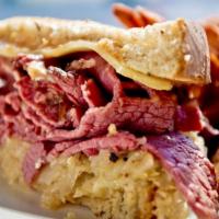 Press Box Reuben · Thinly sliced hot pastrami, Swiss cheese and sauerkraut with thousand island dressing on gri...