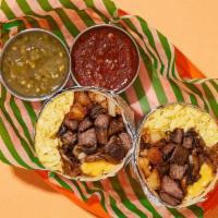 Satisfying Steak & Eggs Breakfast Burrito · Two scrambled eggs with steak, crispy home fries, melted cheese, sauteed mushrooms, and cara...