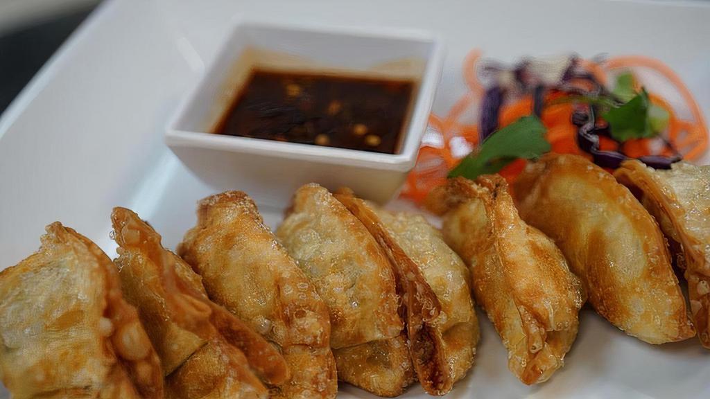 Gyoza · Fried chicken dumplings served with Thai soy sauce