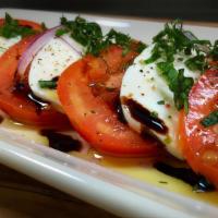 Caprese Salad Dinner · Sliced roma tomatoes and fresh mozzarella topped with basil and olive oil and balsamic reduc...