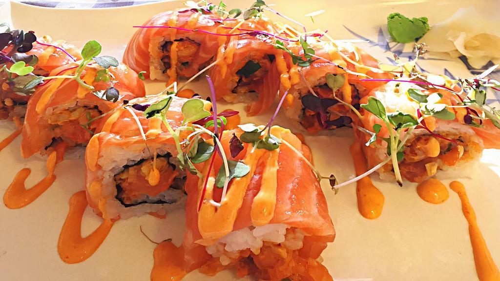 Pink Lady Roll · Spicy salmon roll topped with salmon.