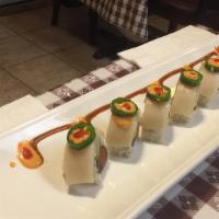 Stepping Stone Roll · Spicy. Tuna, salmon, avocado roll topped with white tuna and jalapeño.