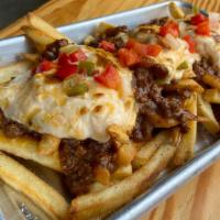 Pub Fries · French fries with chili sauce, pub cheese, and pickled pepper relish