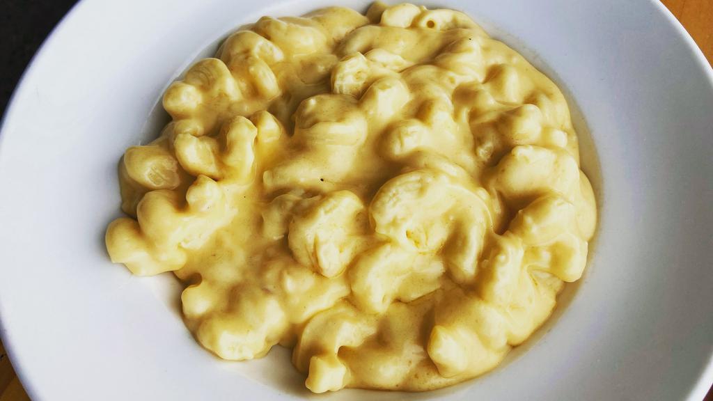 Mac And Cheese · Classic cheddar cheese sauce on cavatappi noodles