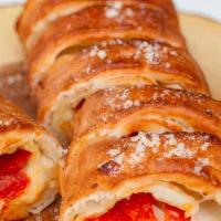 Pepperoni Rolls · Pepperoni, mozzarella, and parmesan cheese rolled up in strips of famous pizza dough and bak...