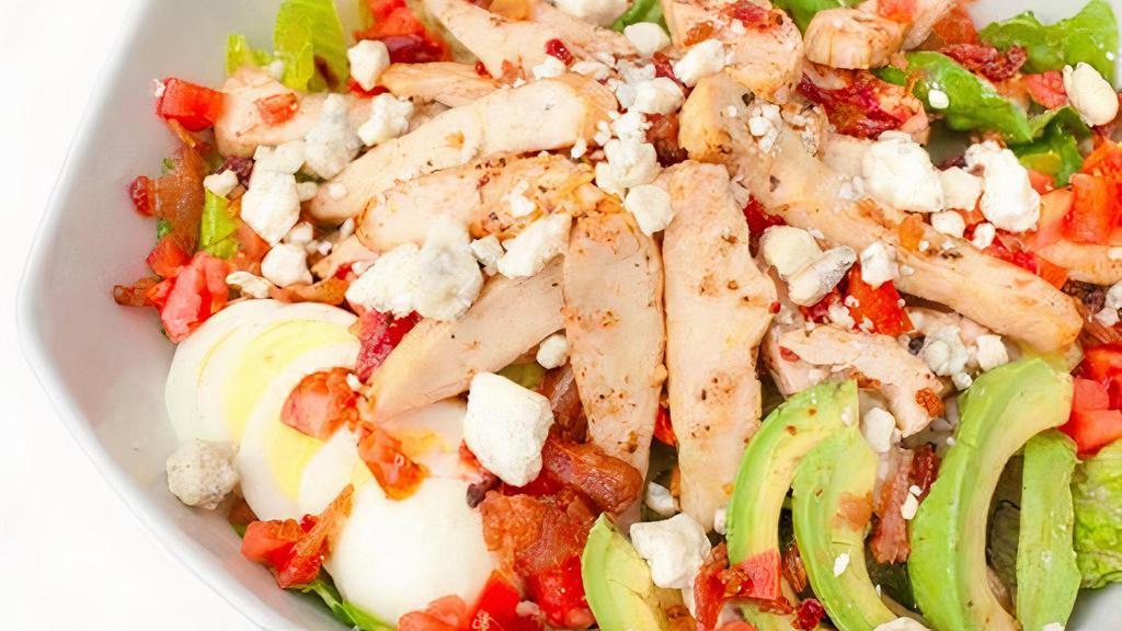 Cobb Salad · Chicken breast, avocado, blue cheese, bacon, tomato, egg, and lettuce with Italian dressing.