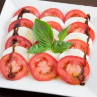 Caprese Salad · A true Italian salad made with fresh mozzarella, fresh basil, tomatoes, and extra virgin oli...