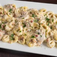 Soprano'S Special Pasta · Cheese filled tortellini, bacon, mushrooms, alfredo sauce, and parmesan. Served with garlic ...