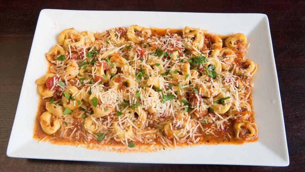 Cheese Tortellini Pasta · Pasta rings filled with cheese and topped with alfredo or marinara sauce. Served with garlic bread.