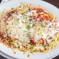 Chicken Parmesan Pasta · Breaded chicken breast, spaghetti, marinara, parmesan, and mozzarella. Served with garlic br...