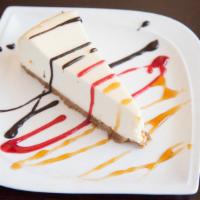 New York Cheesecake · Plain or with raspberry, chocolate, or caramel sauce.