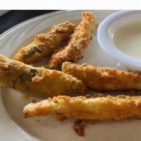 Fried Pickles · 6 hand battered pickle spears, deep fried crispy, and served with ranch dressing.