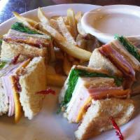 Club · Slices of turkey breast, ham, bacon, American, and swiss cheeses, tomatoes and lettuce toast...