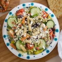 #65. Greek Salad · Includes lettuce, fresh tomatoes, red onion, cucumbers, Greek medley, feta, black olives, be...