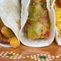 Breakfast Tacos · Your choice of tortilla filled with either Papas a la Mexicana, Just Egg and Bacon, or Just ...