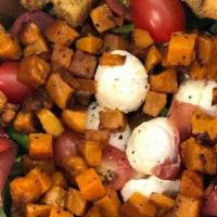 Roasted Pumpkin Salad · Roasted pumpkin, prosciutto, bocconcini, cherry tomatoes, mix greens, basil, croutons, and b...
