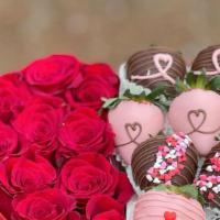 Xoxo Box · XOXO Box consists of chocolate-covered strawberries and fresh flowers. The flowers colors de...