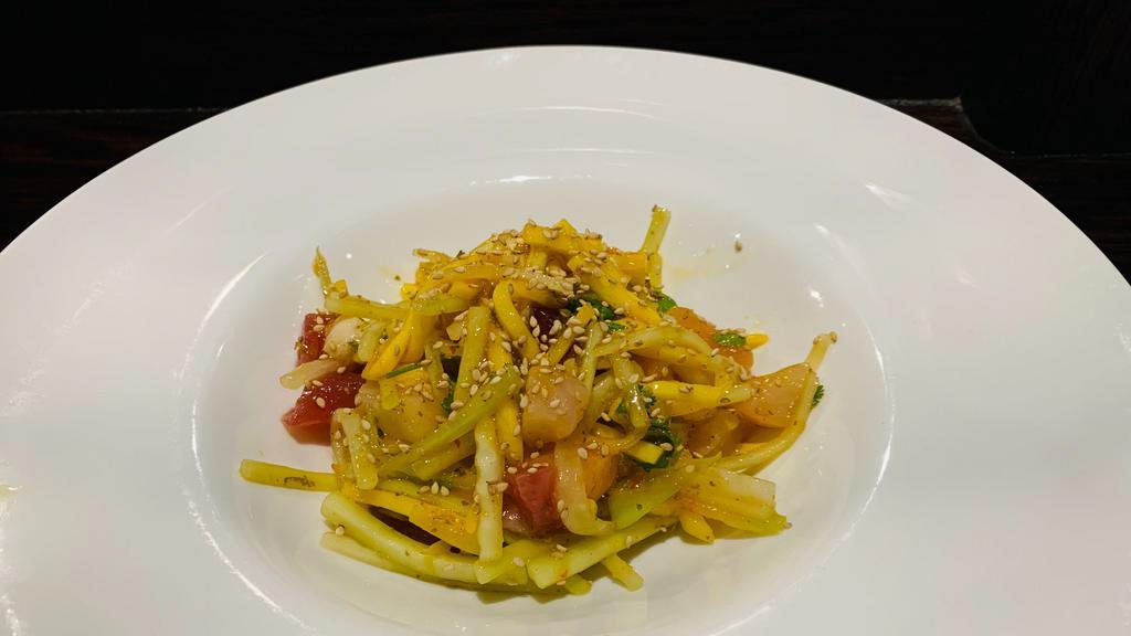 Tango Mango Ceviche* · Spicy. Mixed raw fish, mango, cucumber and cilantro with sweet chili lime dressing.