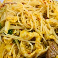 Singapore Noodles · Spicy. Thin rice noodles sauteed with chicken, shrimp, beef, egg mixed veggie and light curry.