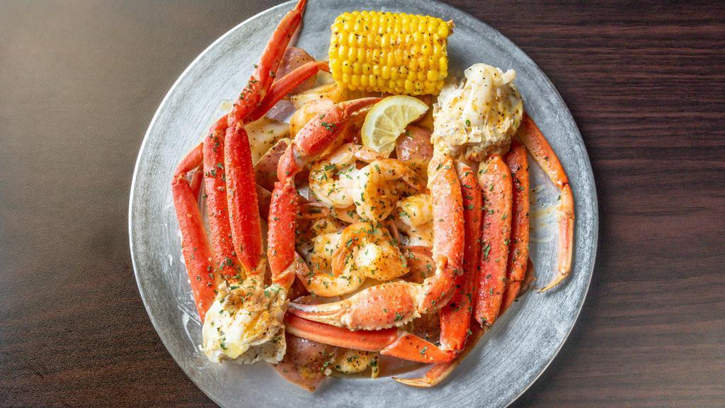 Little Island · Two snow crabs, 12 shrimp, one sausage, one corn, potatoes.