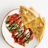 Caprese · Marinated mozzarella, tomatoes, roasted red peppers, basil, balsamic, garlic pizza chips
