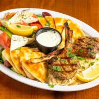 Lamb Chops · Charcoal grilled - served with rice. Side of Greek salad, grilled pita, Greek dressing and t...