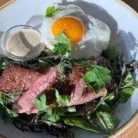 Wagyu Steak & Eggs · Seared wagyu flat iron steak, winter greens salad, French anchovy dressing, crispy potato ha...