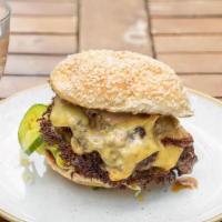 Th Burger · Double patty of grass fed beef, American cheese, shaved lettuce, sweet onions, b&b pickles, ...