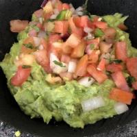 Guacamole Fresco · Fresh ripe avocado hand crushed with tomato, red onion, cilantro, jalapeños, lime and salt.