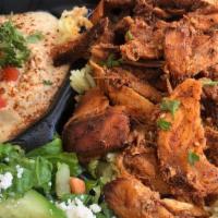 Chicken Shawarma Plate · Served over rice with salad and one side.