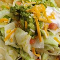 Taco Dorados · 2 Crispy pan fried tacos with choice of shredded chicken or shredded beef, layered with chee...