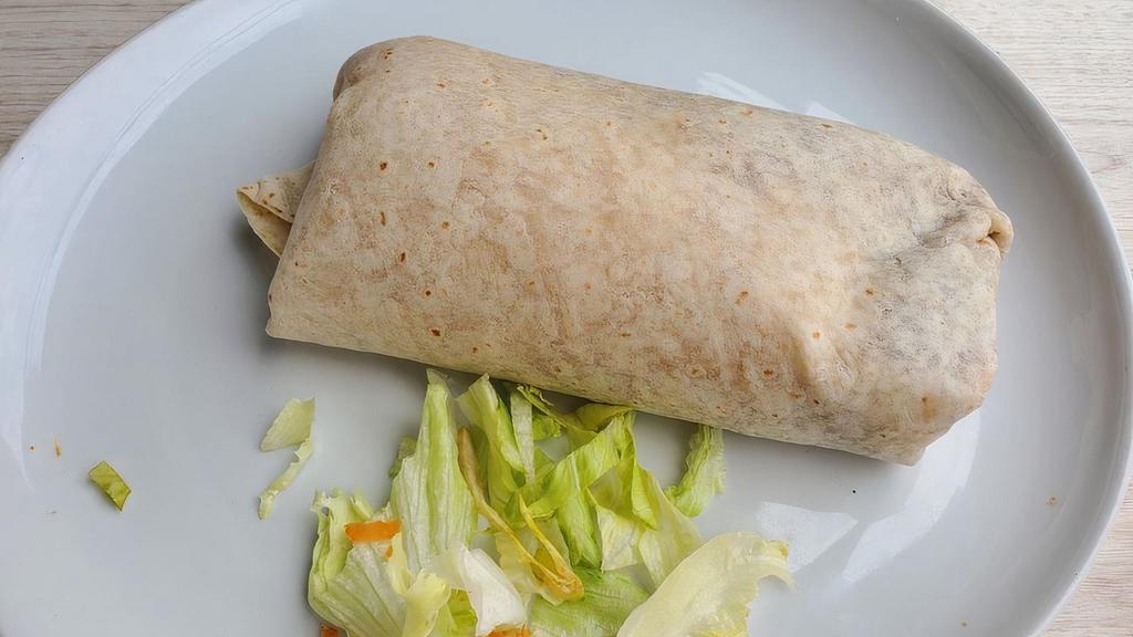 Burrito · Your choice of meat or veggie with Refried beans, rice, and cheese wrapped up in a flour tortilla.
