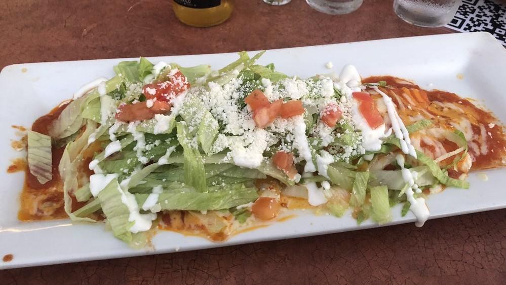 La Fiesta Burrito
 · All meat burritos are served with rice, refried beans, and cheese wrapped inside a flour tortilla. Topped with lettuce, tomatoes sour cream and cotija cheese.