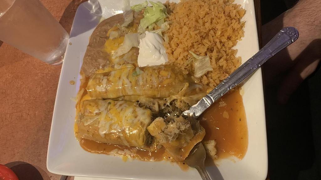 Carnitas Burrito
 · Traditional carnitas or chile verde pork with spanish rice, refried beans, and cheese in a flour tortilla.