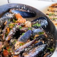 Mussels Cozze · Sauteed Fresh Mussels with Italian Sausage, Garlic, White Wine and Italian Herbs. Served wit...