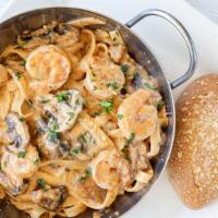 Family Meal Cajun Shrimp Pasta · Fettuccine pasta tossed with mushrooms, house-made spicy Cajun cream sauce sautéed shrimp, S...