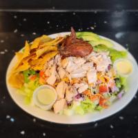 Ranchero Salad · Romaine lettuce, pulled chicken, corn, tomato, onions, black beans, mixed cheese, crunchy to...
