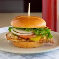 Grilled Chicken Sandwich · Marinated grilled chicken breast with lettuce, tomato, pickles, and onion.