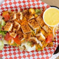 Fried Chicken Salad · Breaded chicken breast, cheddar cheese, tomato, onions, carrots, cabbage, and croutons with ...