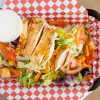Grilled Chicken Salad · Chilled marinated chicken, mixed greens, cheddar cheese, tomato, red onions, carrots, cabbag...