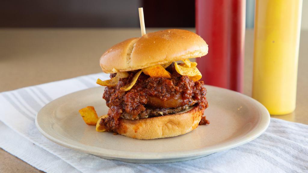 Chili Burger · Double Patty topped with Cheddar Cheese, Our House-Made Chili, Fritos and a Single Onion Ring